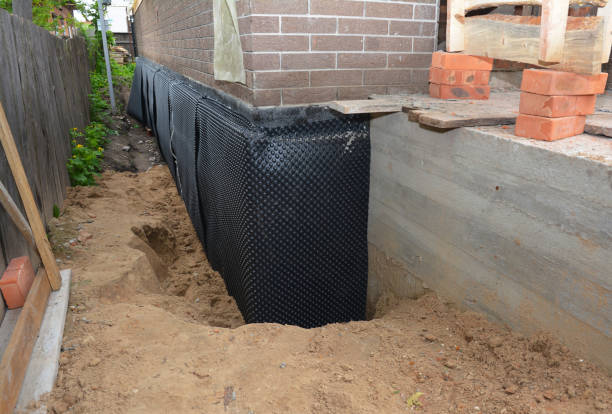 Happy homeowners after waterproofing job in Clarence Center